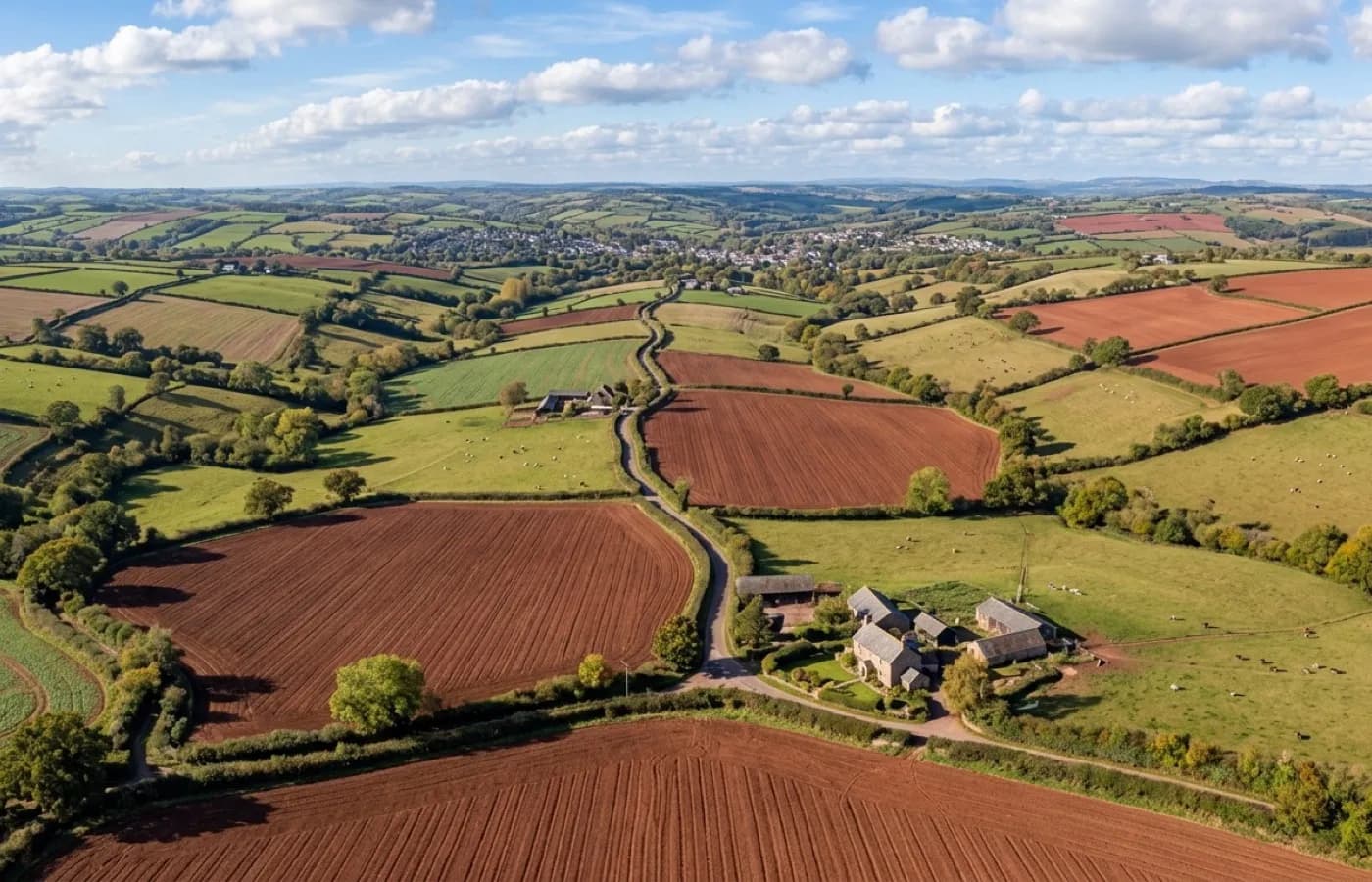 Aerial view of rolling Mid Devon farmland around Tiverton and Crediton
